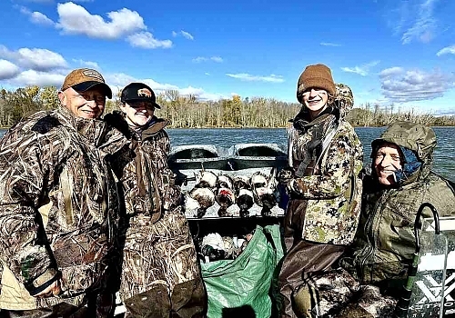 Group poses with hunted ducks