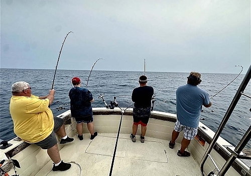  Group fishing on boat on Peaches Pride charter