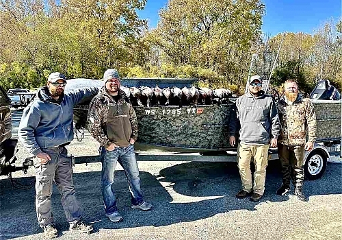  Group poses with catch on duck hunting trip