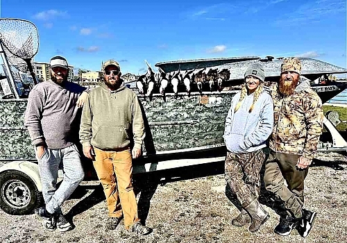  Group showing off ducks hunted on trip