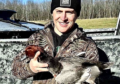  Man poses with duck