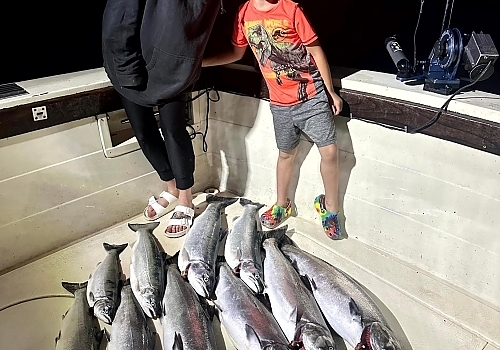 Group showing fish caught at night